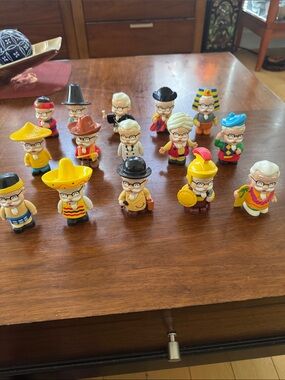 A set of 15 Collectable KFC Colonel Sanders “Around the World” vinyl figures
